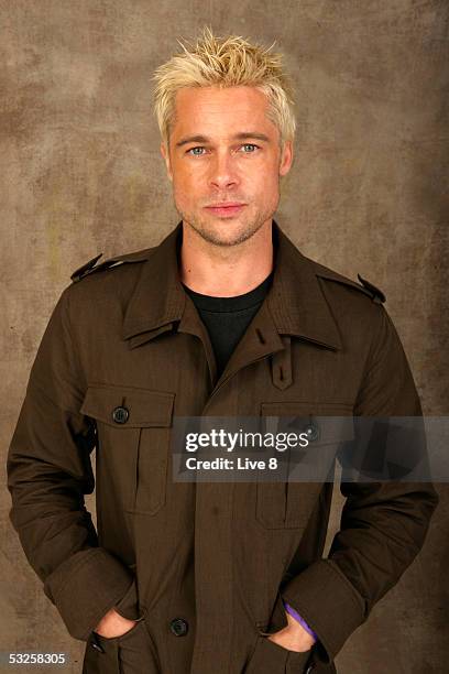 Brad Pitt poses for a studio portrait backstage at "Live 8 London" in Hyde Park on July 2, 2005 in London, England. The free concert is one of ten...