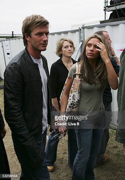 David and Victoria Beckham are seen backstage at "Live 8 London" in Hyde Park on July 2, 2005 in London, England. The free concert is one of ten...
