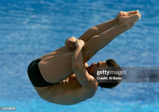 Alexandre Despatie of Canada dives to a first place finish in the three meter diving final during the XI FINA World Championships at the Parc...