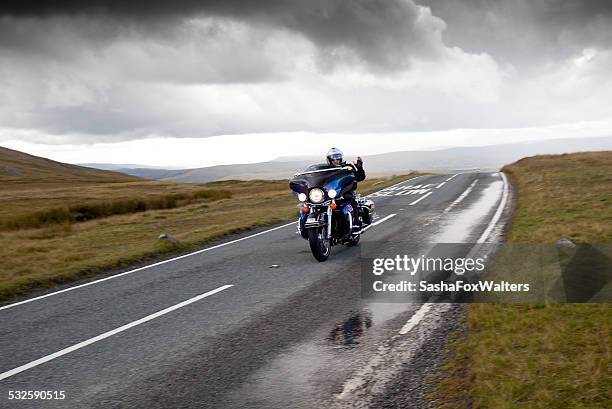 harley davidson motorbike on mountain road - harley davidson stock pictures, royalty-free photos & images