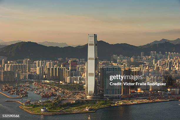 July 2010, Hong Kong, China --- Evening aerial view of the West Kowloon district, dominated by the International Commerce Centre Hong Kong's tallest...