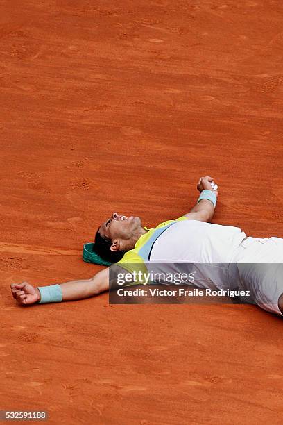 May 2009, Madrid --- Rafael Nadal of Spain lies on the clay as he celebrates match point during the ATP 1000 Mutua Madrilena Madrid Open at the Magic...