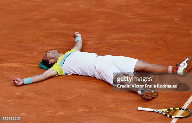 May 2009, Madrid --- Rafael Nadal of Spain lies on the clay as he celebrates match point during the ATP 1000 Mutua Madrilena Madrid Open at the Magic...