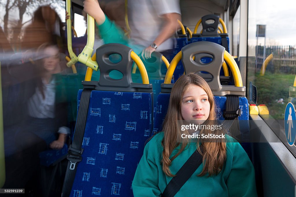 Depressed Schoolgirl Sitting Alone on Bus