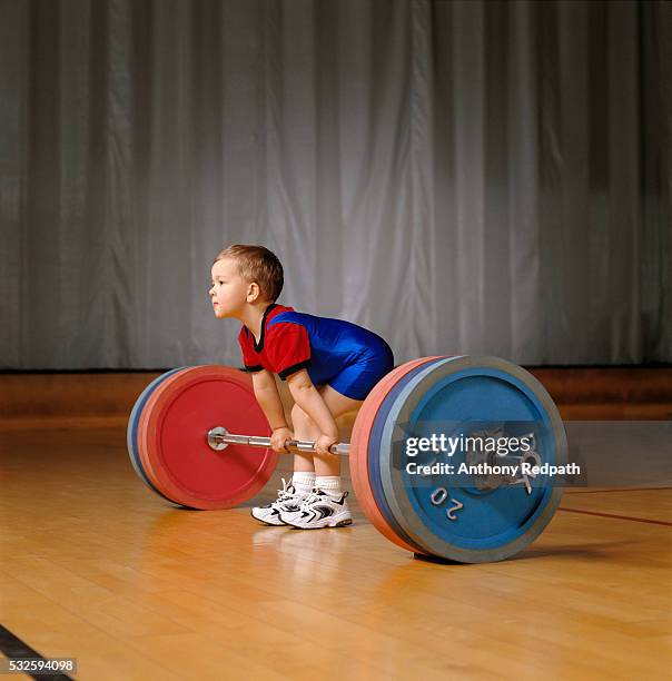 boy preparing to lift barbell and weights - young kid and barbell bildbanksfoton och bilder