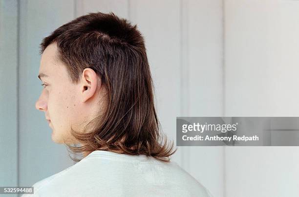 young man with mullet - hairstyle stock-fotos und bilder