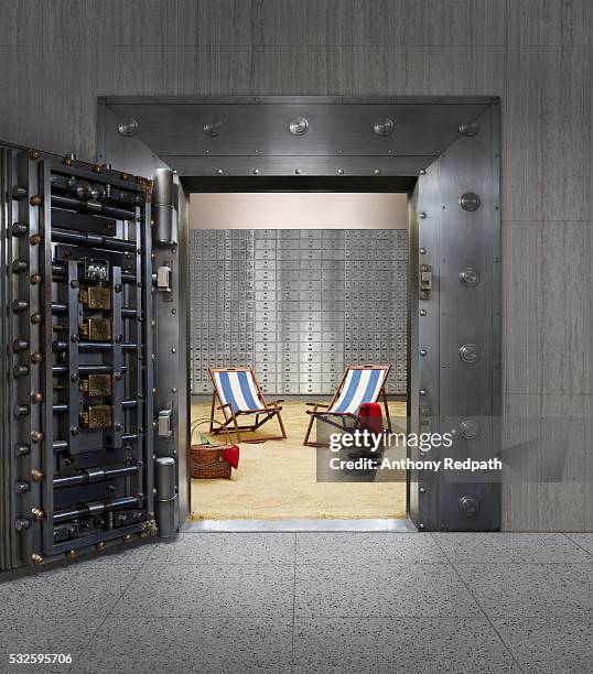 beach chairs in bank vault - safe security equipment stock-fotos und bilder