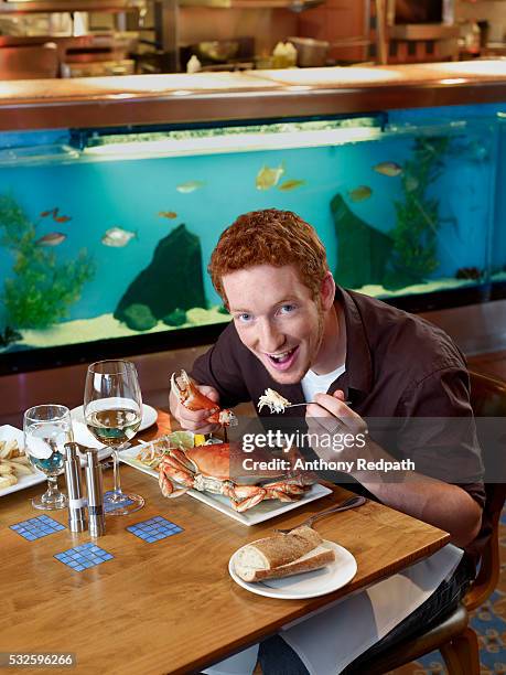 man eating crab for dinner - crab stock pictures, royalty-free photos & images