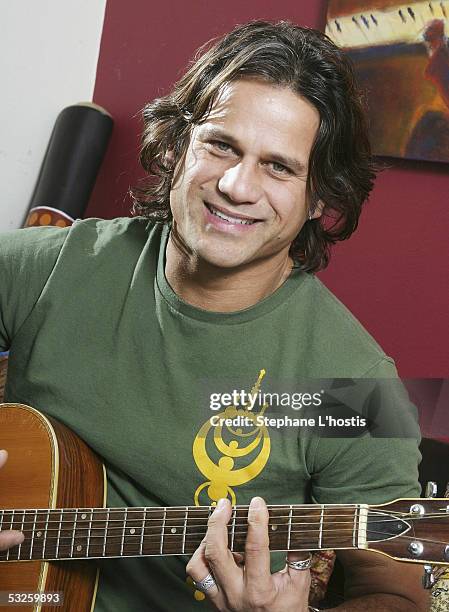 Singer Jon Stevens poses with a guitar July 15, 2005 in Sydney, Australia