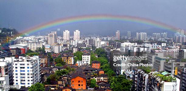 Rainbow appears in the sky after rainstorms following the landing of typhoon Haitang on July 19, 2005 in Fuzhou of Fujian Province, southeast China....