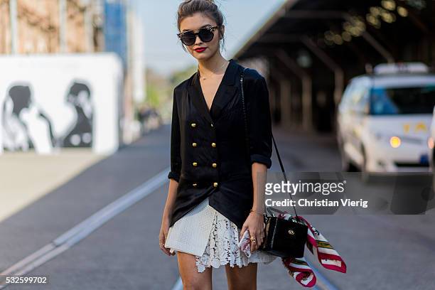 Sarah Ellen wearing a black Burberry blazer, Jimmy Choo sunglasses and a white laced skirt at Mercedes-Benz Fashion Week Resort 17 Collections at...
