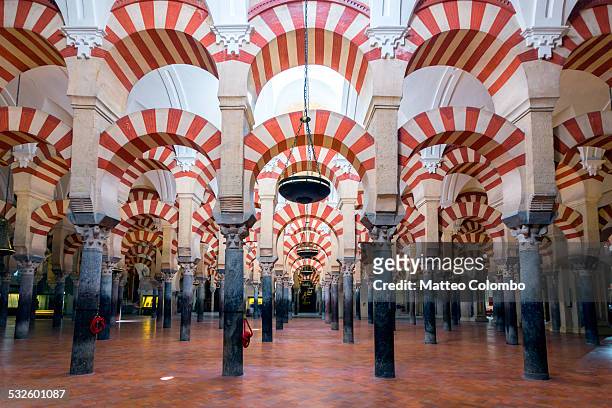 archway inside the mezquita of corboba, spain - mezquita stock pictures, royalty-free photos & images