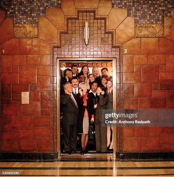crowded corporate elevator - hiss bildbanksfoton och bilder
