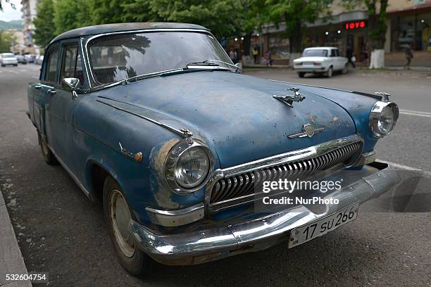 View of the early GAZ-21 Volga car, with the iconic deer mascot, on the street in Stepanakert, on May 18, 2016. Volga , an automobile brand...