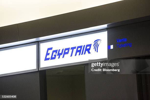 The EgyptAir Airlines logo sits illuminated above the company's ticket office at Charles de Gaulle airport, operated by Aeroports de Paris, in...