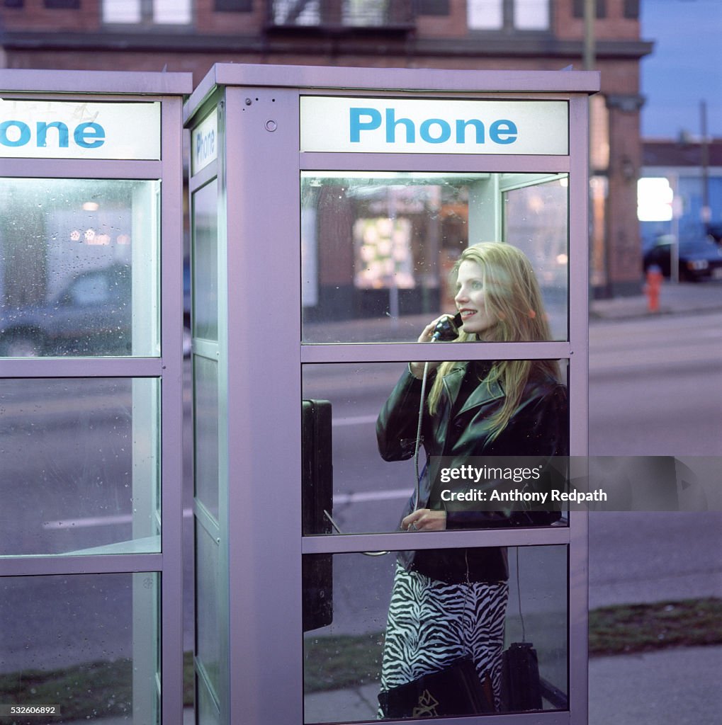 Woman in a phone booth