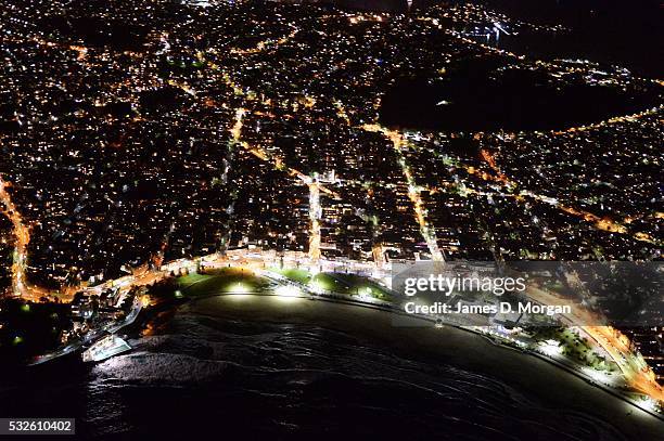 Photographed from 2500 feet above Sydney, the CBD and Bondi twinkle in the evening lights on September 19, 2015 in Sydney, Australia.