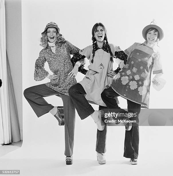 English actress and model Caroline Munro with fashion models Nikki Ross and Lula wearing smock style tunics, 13th February 1972.