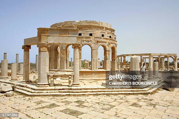 Tourist walks about the rebuilt structure of the market in the Roman citadel of Leptis Magna, as seen in picture taken 10 July 2005. It originally...
