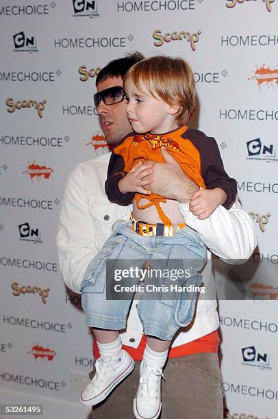 Musician Liam Gallagher of Oasis and son Gene Appleton Gallagher arrive at the HomeChoice Enchanted Wood Tea Party at The Music Room on July 20, 2005...