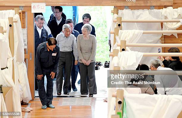 Emperor Akihito and Empress Michiko are seen on arrival at the gymnasium of the Mashiki Chuo Elementary School where people take shelter on May 19,...