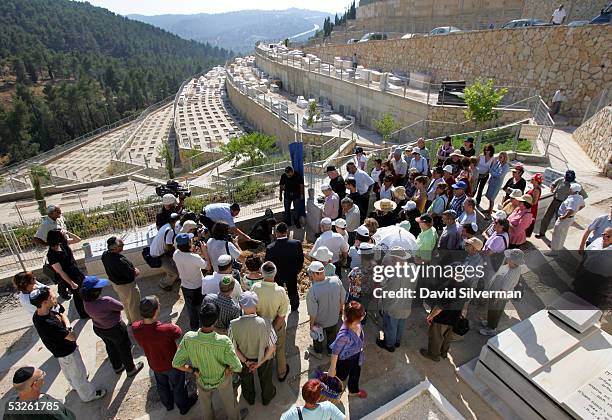Mourners gather round the grave of London terror victim Anat Rosenberg during her funeral July 20, 2005 in Jerusalem, Israel. The Israeli-born...