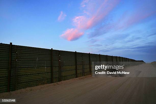 Night settles on the US-Mexico border fence as citizen volunteers prepare for their controversial nightly patrol in search of people crossing into...