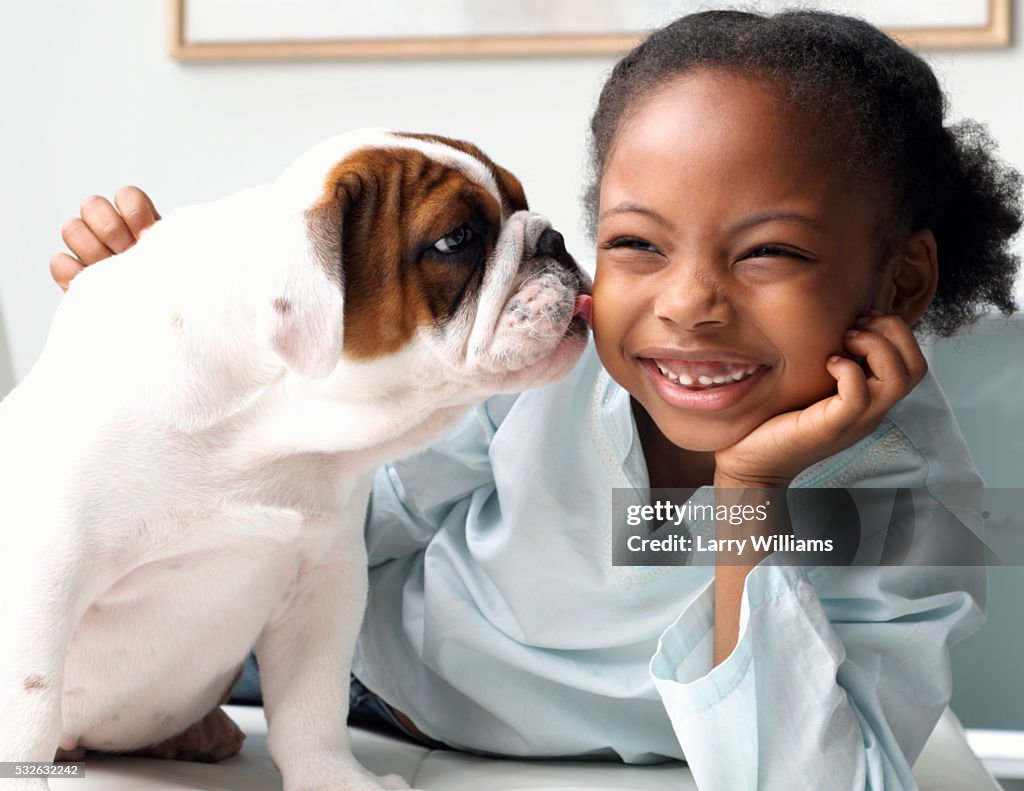 Puppy Licking Girl on Cheek