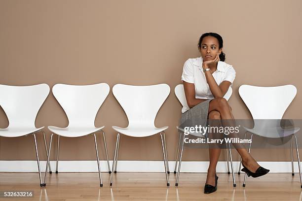 businesswoman in waiting room - frustration concept stock pictures, royalty-free photos & images