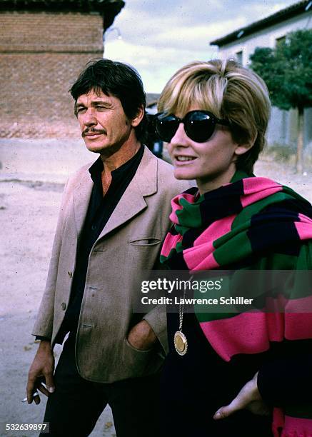 American actor Charles Bronson and British actress Jill Ireland walk together during a break in the production of the film 'Villa Rides' , Andalusia,...