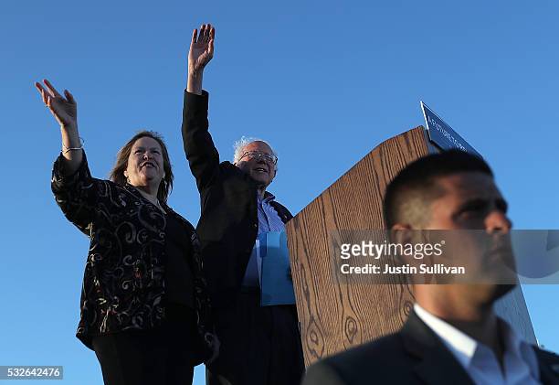 Democratic presidential candidate Sen. Bernie Sanders and his wife Jane O'Meara Sanders greet supporters during a campaign rally at Waterfront Park...