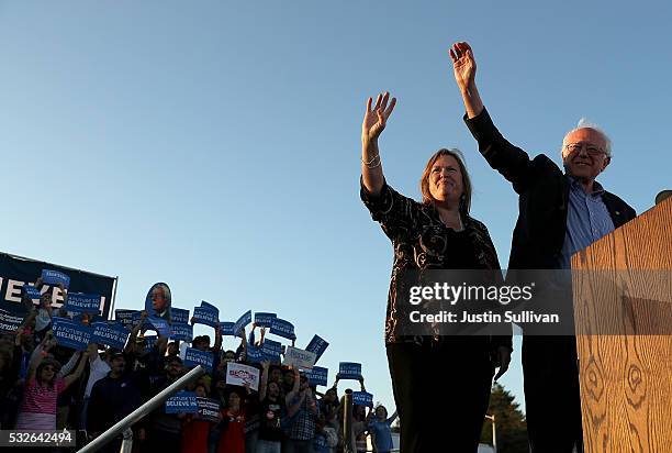 Democratic presidential candidate Sen. Bernie Sanders and his wife Jane O'Meara Sanders greet supporters during a campaign rally at Waterfront Park...