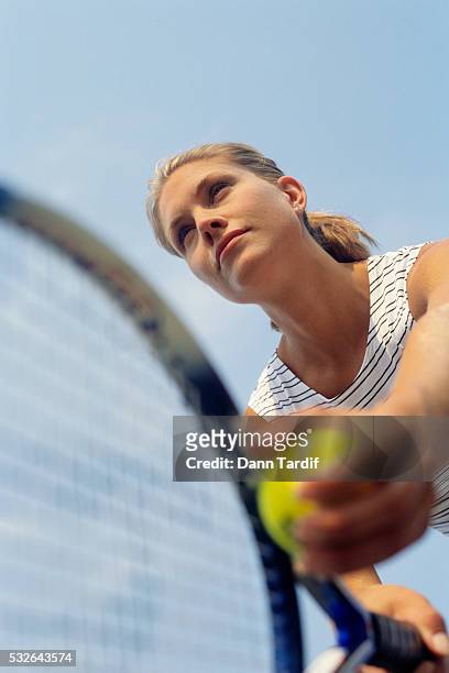 female tennis player preparing to serve - vintage tennis player stock pictures, royalty-free photos & images
