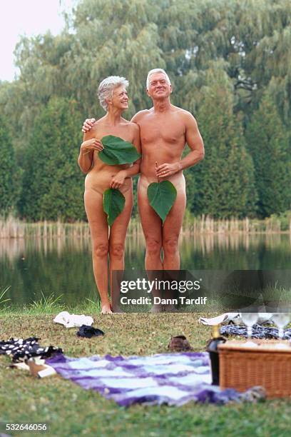 nude senior couple wearing fig leaves - man skinny dipping stock pictures, royalty-free photos & images