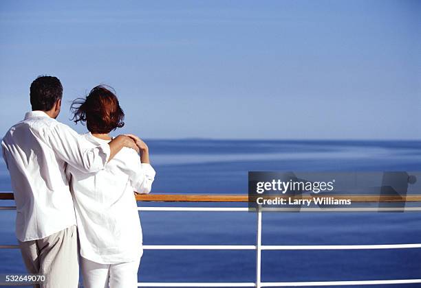 gazing at ocean from cruise ship deck - couple on cruise ship stock pictures, royalty-free photos & images