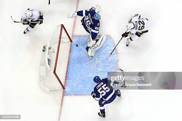 Carl Hagelin of the Pittsburgh Penguins scores a goal during the second period against Andrei Vasilevskiy of the Tampa Bay Lightning in Game Three of...