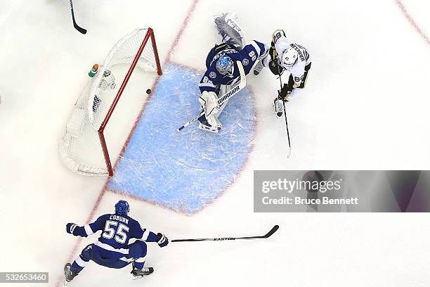 Carl Hagelin of the Pittsburgh Penguins scores a goal during the second period against Andrei Vasilevskiy of the Tampa Bay Lightning in Game Three of...
