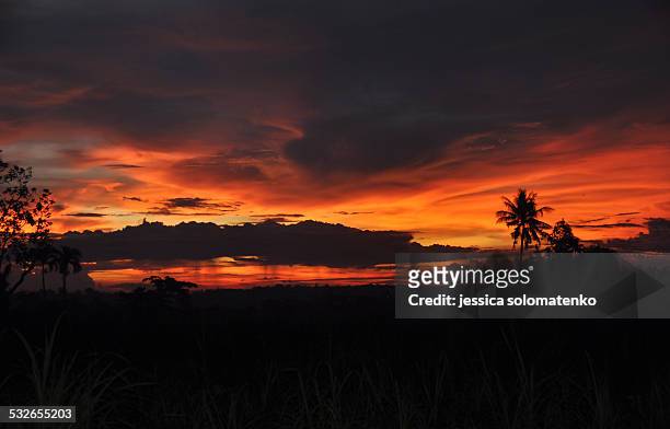 sunset as the thunderstorm approaches - negros occidental stock pictures, royalty-free photos & images
