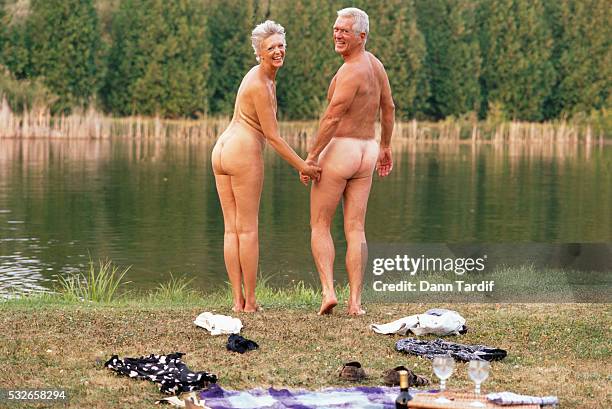 senior couple skinny dipping - skinny dipping stock-fotos und bilder