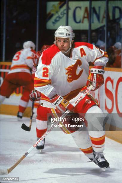 Canadian hockey player Al MacInnis of the Calgary Flames on the ice during a home game, Calgary, Alberta, Canada, early 1990s.