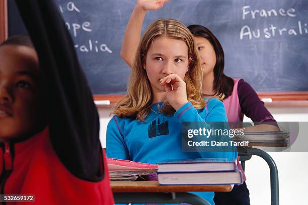 schoolgirl pondering class question - shy stock pictures, royalty-free photos & images