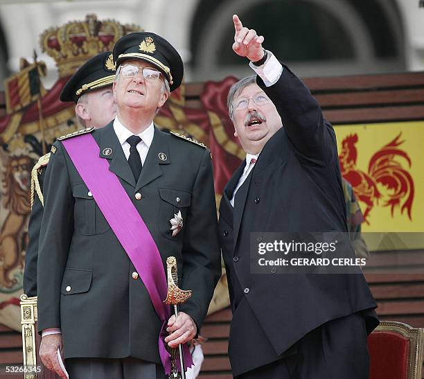 Belgium King Albert II and Defence minister Andre Flahaut are pictured during the National day military parade 21 July 2005 in front of the Royal...