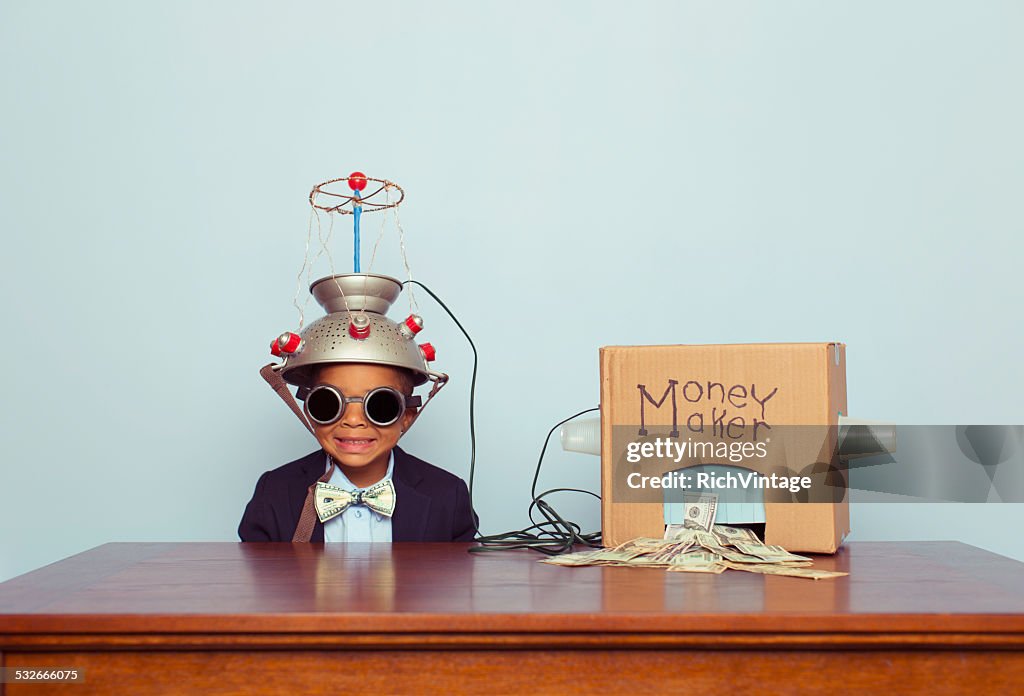 Young Business Boy wearing Mind Reading Helmet Makes Money