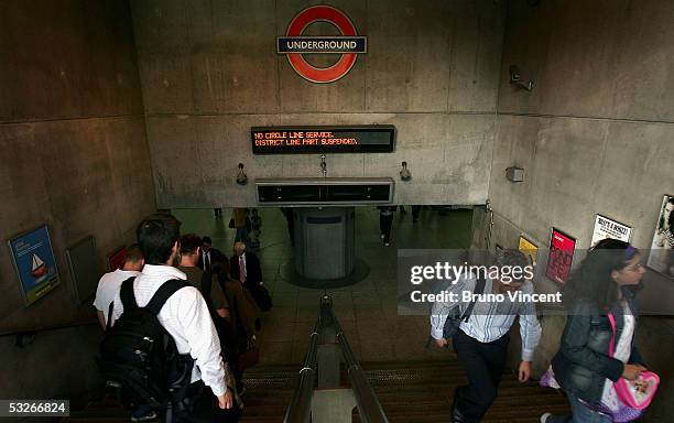 Commuters make their way home at Embankment tube station on July 21, 2005 in London. Three London underground train stations have been evacuated...