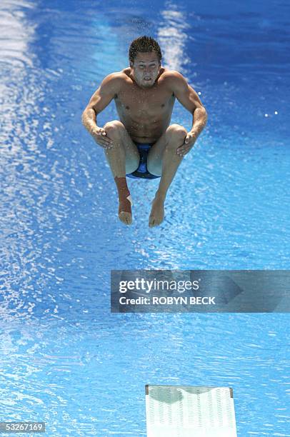 Jevon Anton Tarantino of the US performs in the Men's1m Springboard Diving competition 21 July 2005 at the XI FINA World Championships in Montreal,...