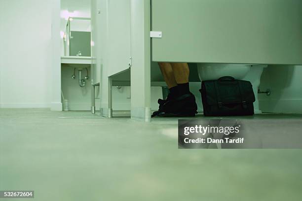 businessman using restroom - public toilet stock pictures, royalty-free photos & images