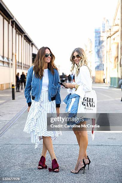 Tash Sefton, wearing J.W. Anderson outfit and NO 21 heels, with Elle Ferguson, wearing Scanlan Theodore heels, Bassike shorts, HM top and Dinosaur...