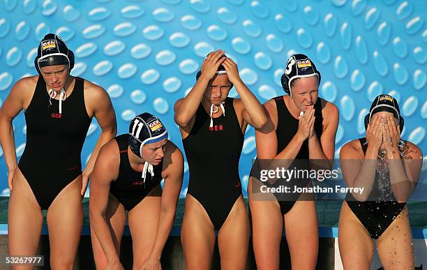 Nadine Kunz, Mandy Zoellner, Theresa Klein, Sabrina Blattau and Linda Gerritsen of Germany watch the final moments of their preliminary match against...