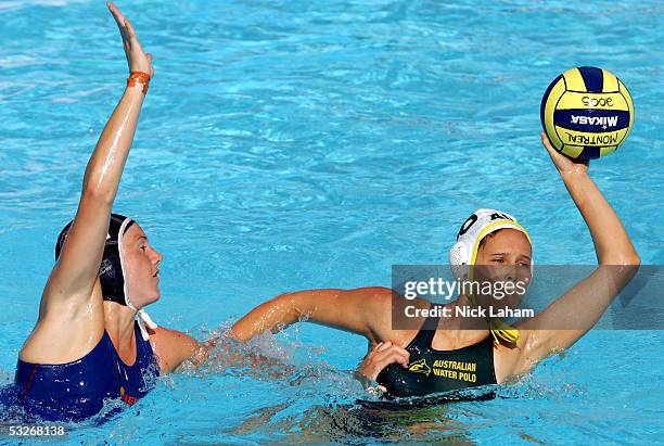 Suzie Fraser of Australia looks for an open pass away from Yasemin Smit of the Netherlands in the preliminary match during the XI FINA World...