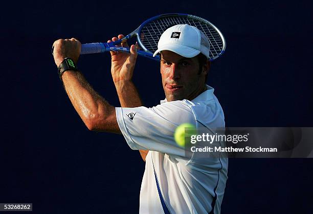 Greg Rusedski of Great Briatin returns a shot to Kenneth Carlsen of Denmark during the RCA Championships July 21, 2005 at Indianapolis Tennis Center...